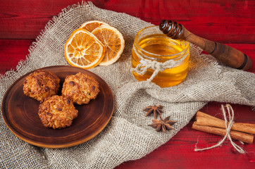 Homemade oatmeal cookies jar of honey and fruit chips. Sweet and tasty dessert.