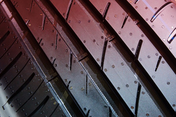 Tyre treads texture, dark abstract background