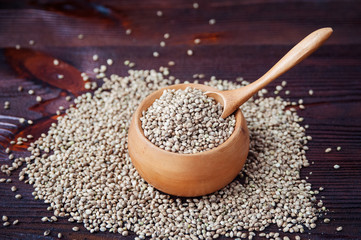 Hemp seeds in wooden bowl.
