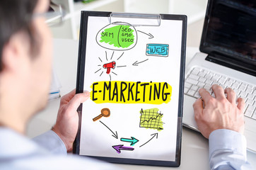 E-marketing concept on a clipboard