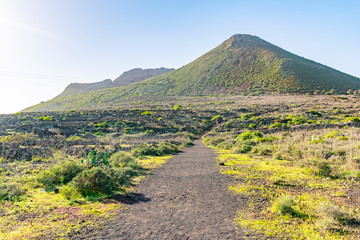 Fototapeta premium Walking trail road on The Vulcano La Corona near Ye village, north of Lanzarote, Canary Islands, Spain