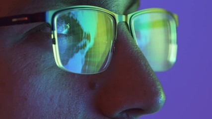 The face of the man looking on the display