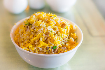 chinese fried rice with egg in a porcelain china bowl