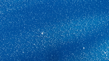snow on blue background