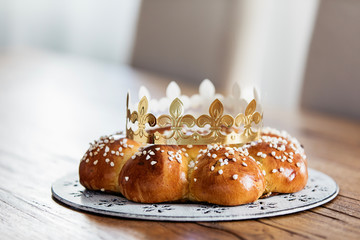 King Cake or King Bread, called in German language Dreikönigskuchen, baked in Switzerland on January 6th,. Small plastic figure is hidden inside. The person, who finds it, is the king of the day