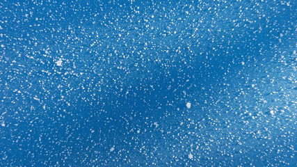 snow on blue background