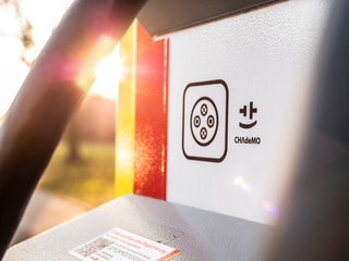 Symbol CHAdeMO Electric Vehicle charging with lens flare