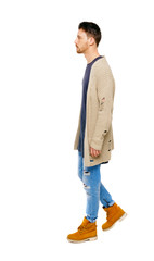 Naklejka premium Side view of going handsome man in a warm sweater.