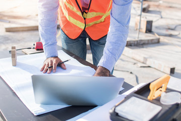 engineer planing and working on table in construction working site