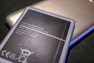 Rechargeable Lithium Mobile Battery with Printed Specifications.