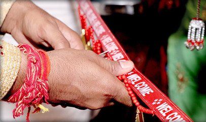 Cutting Ribbon in Indian Wedding Ritual Welcome Ceremony