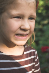 Child with a dental orthodontic device and without one tooth