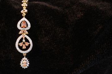 Fototapeta na wymiar Designer Indian traditional jewelry piece for woman's head 