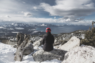 Snowboarder Sitting Enjoying a Heavenly View of Lake Tahoe