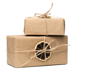 craft paper presents with dry citrus isolated on white.