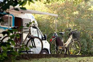 Barcis, Pordenone, Italy a picturesque place camping tourist parking by cars and bicycles.
