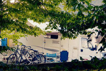 Barcis, Pordenone, Italy a picturesque place camping tourist parking by cars and bicycles.