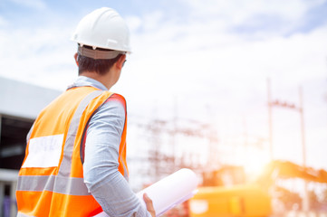 Asiatic engineers are work inspecting the electric building