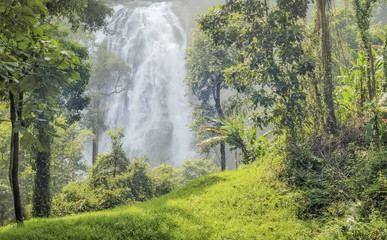 Khlong Lan Waterfall, Beautiful waterfalls flowing from the chill around with green forest background in khlong Lan national park, Kamphaeng Phet, Thailand. 