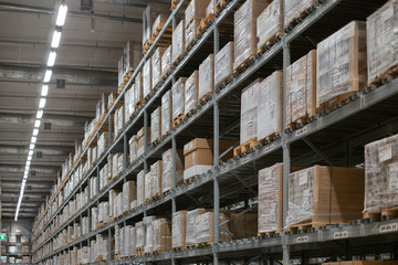 interior of modern warehouse. Rows of shelves with boxes