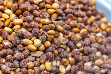 SALTED AND ROASTED PEANUTS. CLOSE UP.