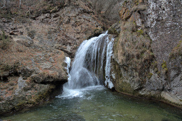 Scenic Honey Waterfalls in a snowless winter. Karachay-Cherkessia, Russia