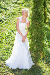 Obraz na płótnie Canvas Beautiful sensual bride blonde in wedding dress 