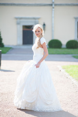 Fototapeta na wymiar Beautiful sensual bride blonde in wedding dress 