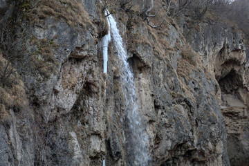 Scenic Honey Waterfalls in a snowless winter. Karachay-Cherkessia, Russia