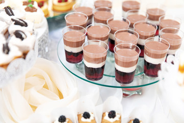 Assortment of pieces of cake on messy table