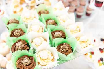 Assortment of pieces of cake on messy table