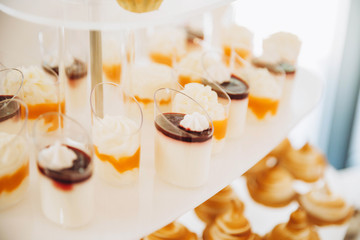 Assortment of pieces of cake on messy table