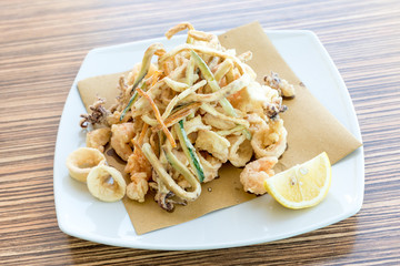 Fried mixed fish with lemon