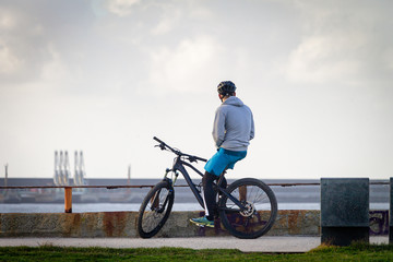Young Biker Contemplates the Port