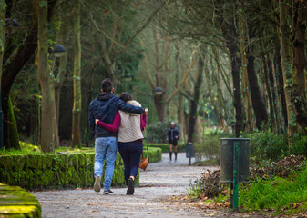 Young Couple Walks in the Park