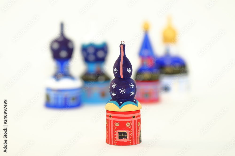 Wall mural Shallow focus Set of wood painted cupola tower toy, orthodox towers toy, mausoleum toy, souvenir russian style isolated on white background.