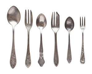 Vintage tea spoons and forks isolated on a white background. Retro silverware