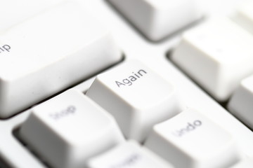 Modern computer keyboard. some part of white computer keyboard, Focus on special key "Again".