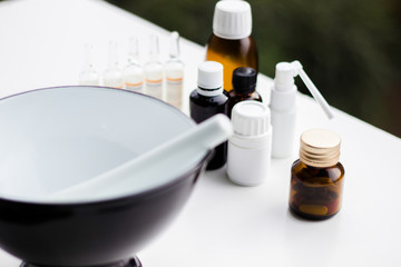 Mortar and pestle with pills and pill bottles 