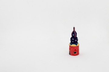 Obraz premium wood painted cupola tower toy, orthodox towers toy, souvenir russian style isolated on white background.