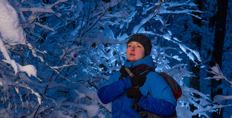 Fototapeta na wymiar Portrait of a woman in the snowy woods.