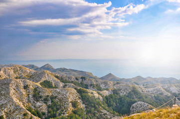 Fototapeta na wymiar Landscape of croatian sea and mountains seen from the peak of mountains with the sea in the background. 