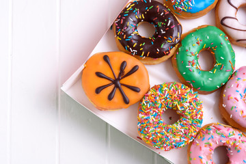 Colorful Donuts with Coffee in White Backdrop