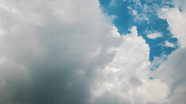 4K Time lapse video video Scene of A group of fluffy white clouds movement whit blue sky on the day good weather and wind. nature and travel concept.