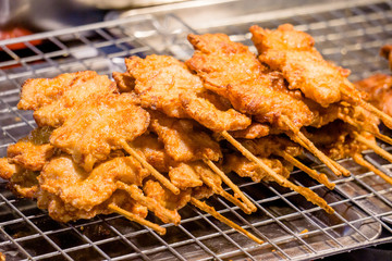 Fried chicken drumsticks on a nigth background.