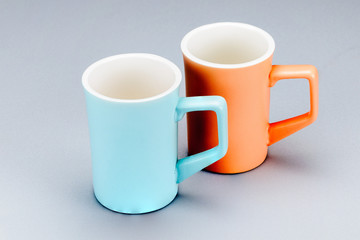 Two tea porcelain clay mug on the white background