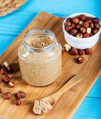 Hazelnut butter on wooden background