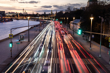 Fototapeta na wymiar Car light trails on the road leading to Moscow Kremlin during sunset