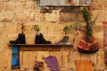 Curiosities in Acre, Akko, boots and shoes, handbags, as flower pots, exterior design and decoration, in Israel
