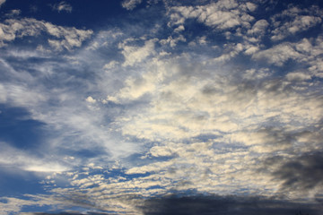 Fototapeta na wymiar Friendly blue sky with 75% clouds as background or wallpaper with space for text. . 